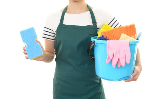 Technician preparing carpet cleaning equipment in a safe working area